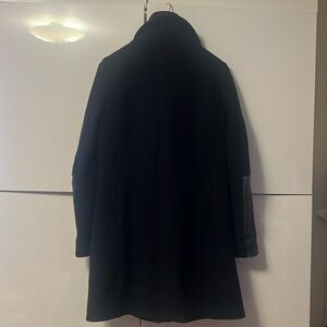 Black Coat with black leather sleeve trim100% italian wool.Size M. Elegant/warm.